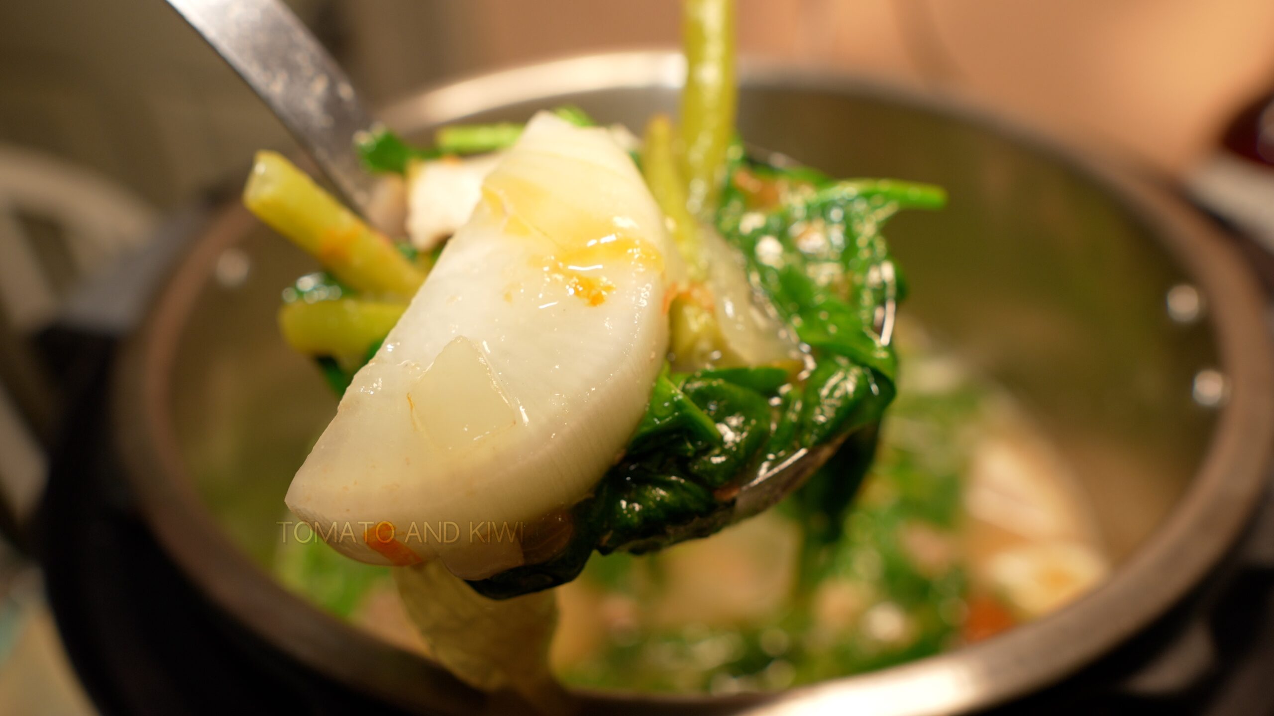 Ladle full of Instant Pot Pork Belly Sinigang